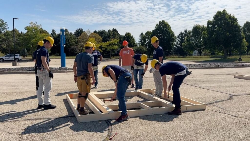 Volunteers with American Family Insurance work to build a home for Habitat For Humanity. (Spectrum News 1/Natalie Sopyla)